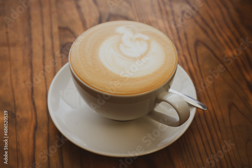 Fotografie Caffe Latte on Wooden Table - Coffee time in Vietnam
