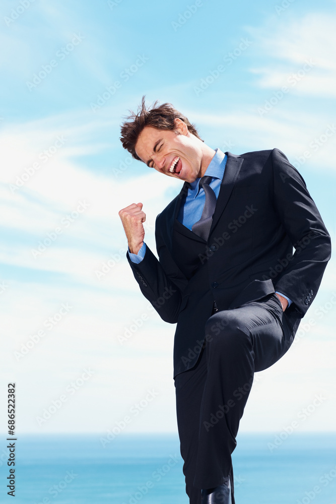 Business man, fist pump and yes for success, celebration and excited for achievement or victory. Happy businessperson, promotion and bonus or salary increase, opportunity and blue sky background Business man, fist pump and yes for success, celebration and excited for achievement or victory. Happy businessperson, promotion and bonus or salary increase, opportunity and blue sky background