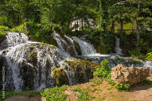 A small waterfall in a stream which runs through the village of Martin Brod in Una-Sana Canton  Federation of Bosnia and Herzegovina. Located within the Una National Park. Early September