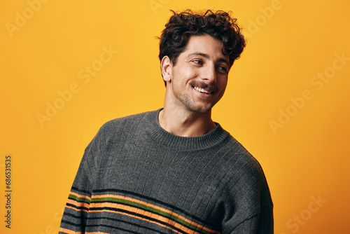 Man fashion smile sweater portrait thoughtful natural student happy male orange trendy background