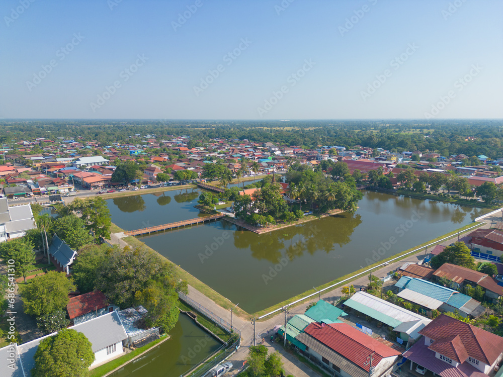 Aerial view of local residential neighborhood roofs. Urban housing development from above. Top view. Real estate in Sukhothai urban city town, Thailand. Property real estate.