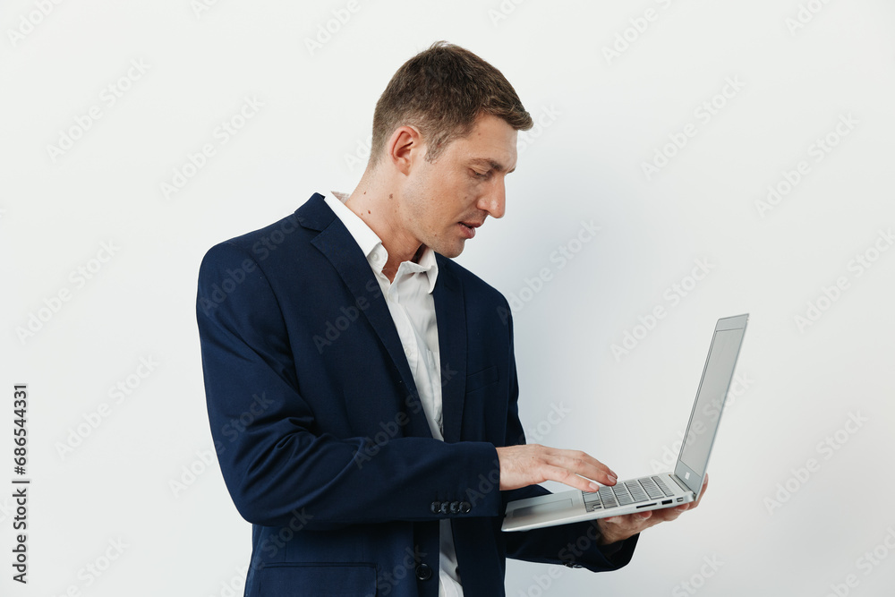 Typing serious successful smart men executive suit using confident men wireless notebook expertise manager Typing serious successful smart men executive suit using confident men wireless notebook expertise manager