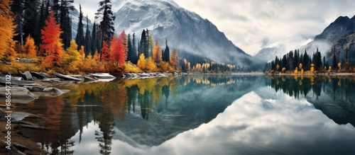 Autumn landscape reflected in Canadian mountain lake. photo