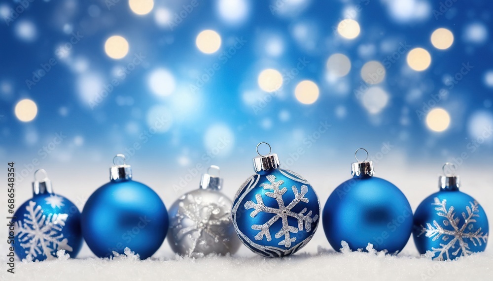 Blue christmas balls with snowflakes on bokeh background Blue christmas balls with snowflakes on bokeh background