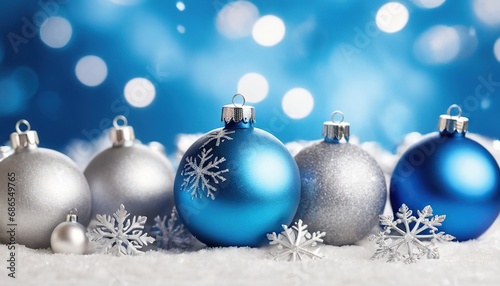 Blue christmas balls with snowflakes on bokeh background