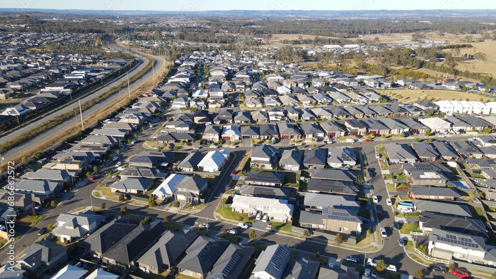 Aerial drone view of the newly constructed homes and streets at Arcadian Hills, Cobbitty in South West Sydney, NSW Australia on a sunny day