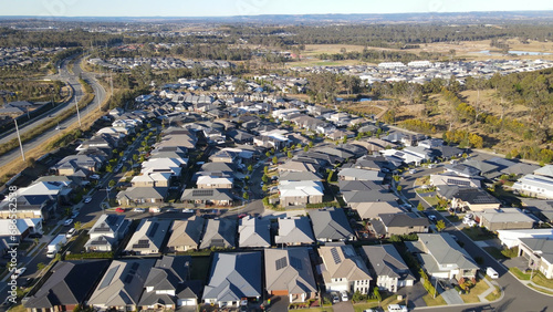 Aerial drone view of the newly constructed homes and streets at Arcadian Hills, Cobbitty in South West Sydney, NSW Australia on a sunny day