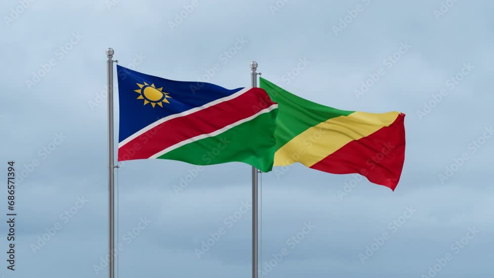 Republic of the Congo flag and Namibia flag waving together on cloudy sky, endless seamless loop, two country relations concept Republic of the Congo flag and Namibia flag waving together on cloudy sky, endless seamless loop, two country relations concept