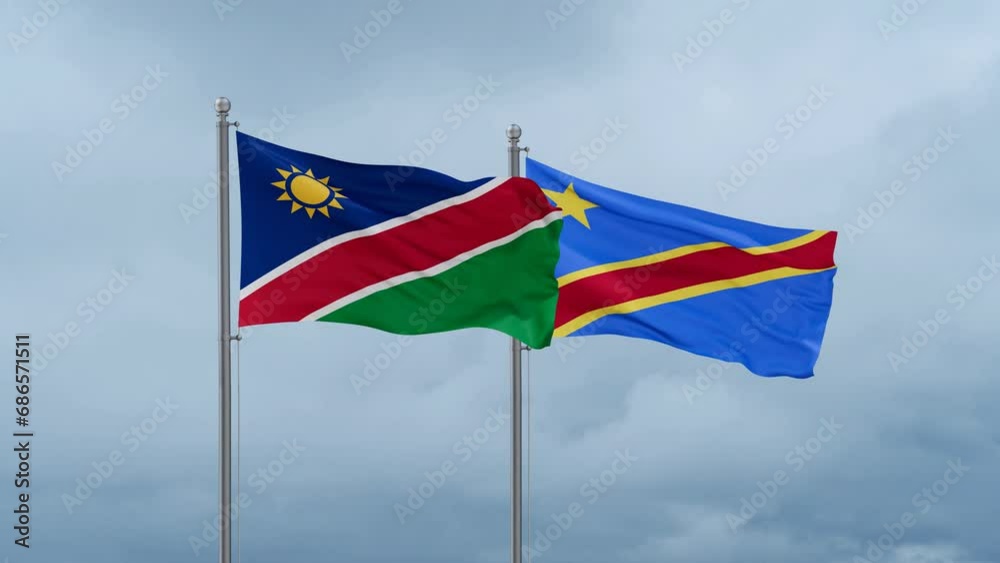 Democratic Republic of the Congo flag and Namibia flag waving together on cloudy sky, endless seamless loop, two country relations concept Democratic Republic of the Congo flag and Namibia flag waving together on cloudy sky, endless seamless loop, two country relations concept