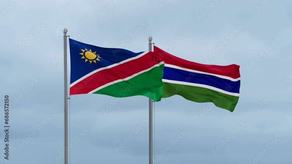 Gambia flag and Namibia flag waving together on cloudy sky, endless seamless loop, two country relations concept Gambia flag and Namibia flag waving together on cloudy sky, endless seamless loop, two country relations concept