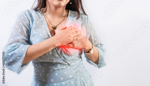 Unrecognizable woman with chest pain isolated. Girl with heart pain on isolated background. Concept of people with heart problems photo