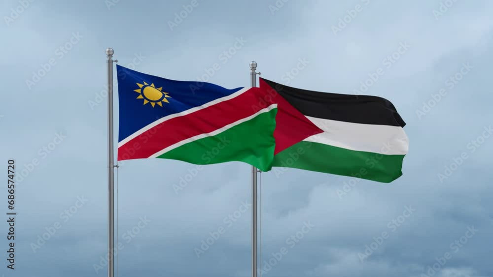 Palestine and Gaza Strip flag and Namibia flag waving together on blue sky, looped video Palestine and Gaza Strip flag and Namibia flag waving together on blue sky, looped video