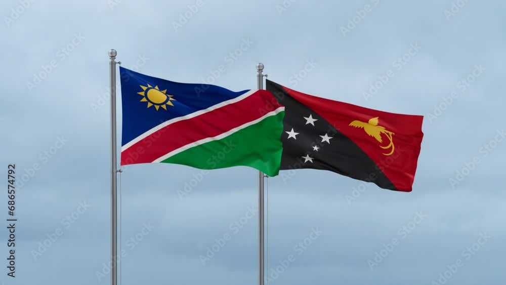 Papua New Guinea flag and Namibia flag waving together on cloudy sky, endless seamless loop, two country relations concept Papua New Guinea flag and Namibia flag waving together on cloudy sky, endless seamless loop, two country relations concept