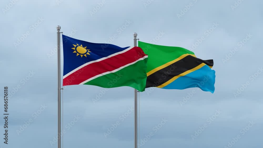 Tanzania and Namibia flag waving together on cloudy sky, endless seamless loop, two country cooperation concept Tanzania and Namibia flag waving together on cloudy sky, endless seamless loop, two country cooperation concept
