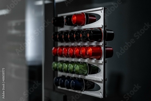 capsulas de café ordenada por colores sobre la pared photo