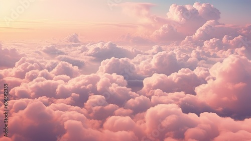 Blue sky with fluffy pink clouds at sunset, dawn of the day. Warm pastel colors, serene romantic background. photo