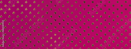 Dark purple background from metal foil paper with pattern of golden stars. Texture of wine wrapping backdrop.