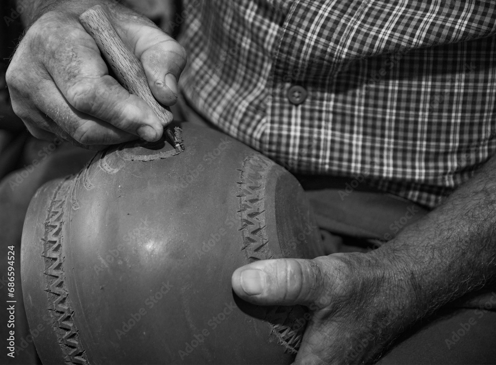 master potter while modeling Vadastra Ceramica clay vessels
