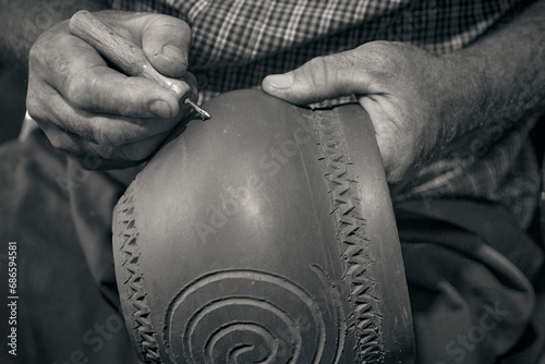 master potter while modeling Vadastra Ceramica clay vessels photo