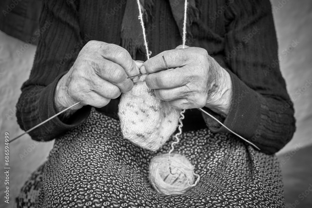 hands crocheting traditional woolen stockings