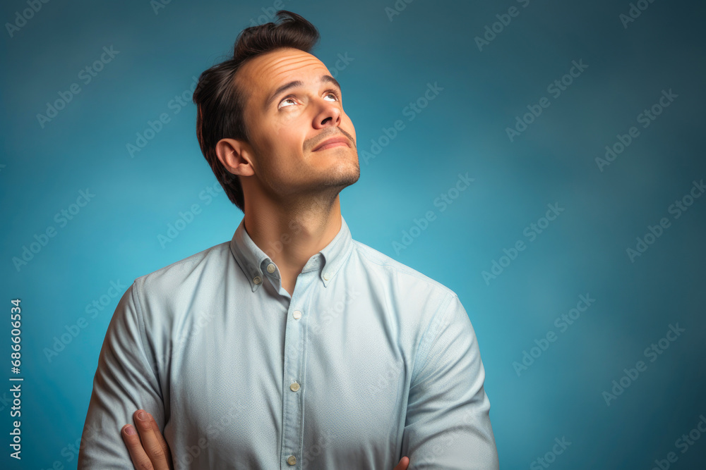 Contemplative male model against vibrant, minimalistic setting Contemplative male model against vibrant, minimalistic setting