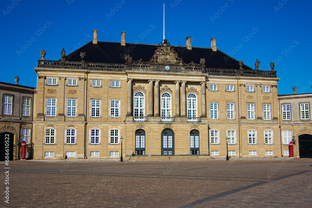Amalienborg castle is the official residence for the Danish royal family, and is located in Copenhagen, Denmark. It consists of four identical classical palace facades with rococo interiors 