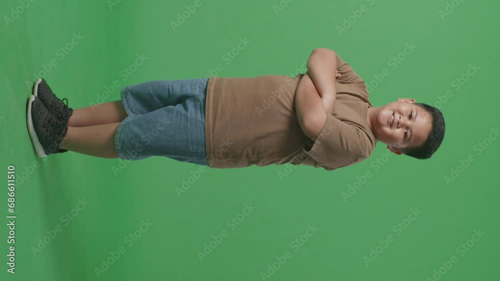 Full Body Of Side View Of Asian Boy Crossed Arms And Warmly Smiling On Green Screen Background
Full Body Of Side View Of Asian Boy Crossed Arms And Warmly Smiling On Green Screen Background