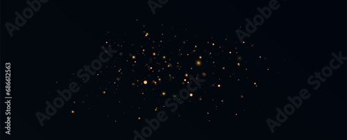 Golden sequins glow with many lights. Glittering dust. Luxurious background of golden particles.	