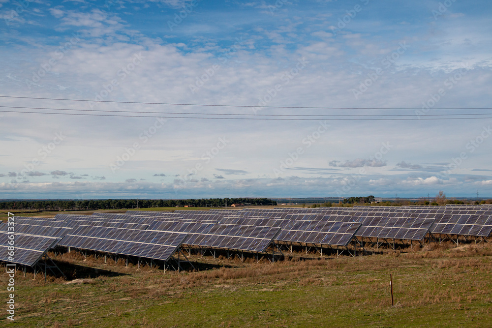Solar panel farm on a sunny day producing clean electrical energy Solar panel farm on a sunny day producing clean electrical energy
