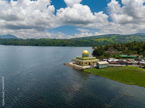 View of Linuk Mosque and Lake Lanao in Lanao del Sur. Blue sky and clouds. Mindanao, Philippines. photo