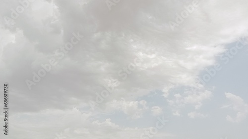 Fototapeta Naklejka Na Ścianę i Meble -  Enchanting Skyline: A Beautiful Vista with Clouds Adorning the Attractive Blue Sky