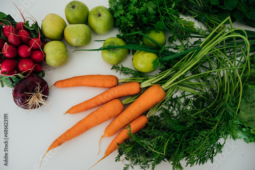 fresh vegetables for eating carrot radish green salad on white background