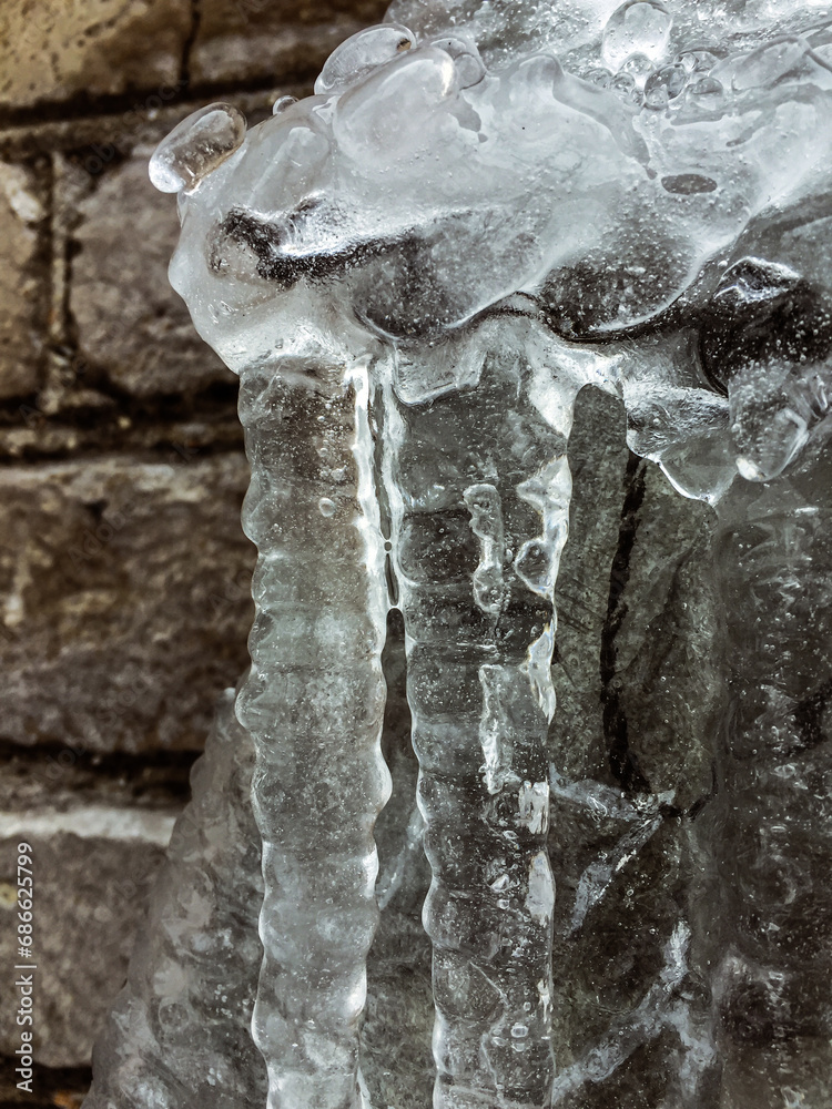 Stream of water frozen in the cold Stream of water frozen in the cold
