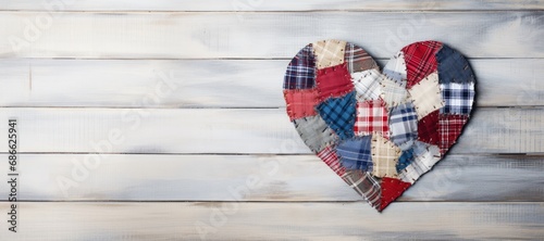 patchwork heart on a wooden background with a place for text