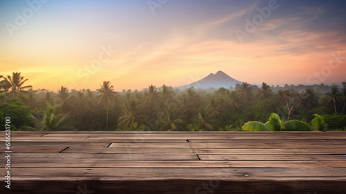 Wooden platform with tropical mountainous landscape at sunset island natural product placement platform. © Alina Nikitaeva
