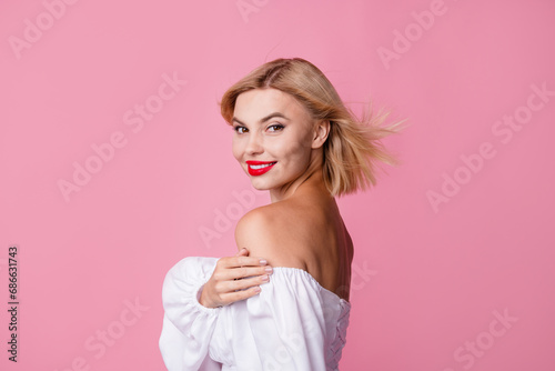Photo of cute pretty tender girl dressed stylish clothes hugging herself isolated on pink color background