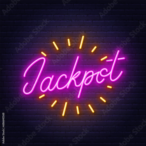 Neon sign Jackpot on brick wall background.