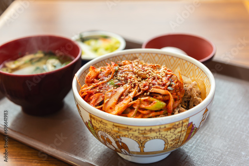 Beef rice bowl with kimchi, korean and japanese traditional fusion food style culture. photo