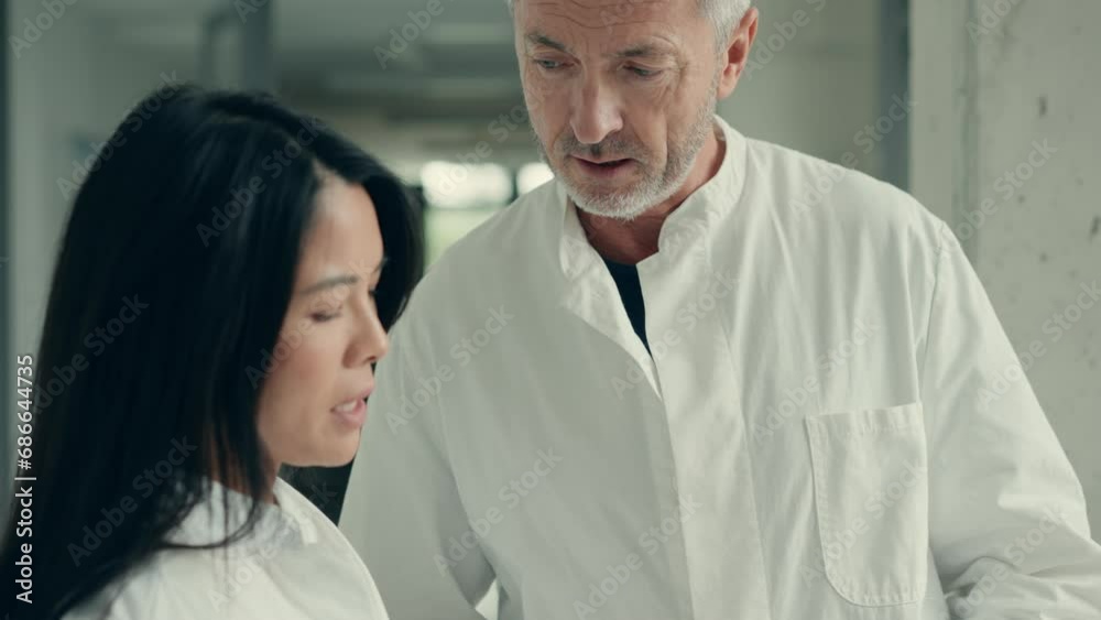 Two doctors discussing patient's condition Two doctors discussing patient's condition