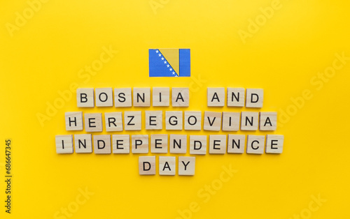 On March 1, Independence Day of Bosnia and Herzegovina, a minimalistic banner with an inscription in wooden letters on an orange background