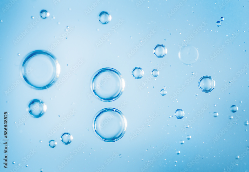 macro photography of air bubbles in light blue water
