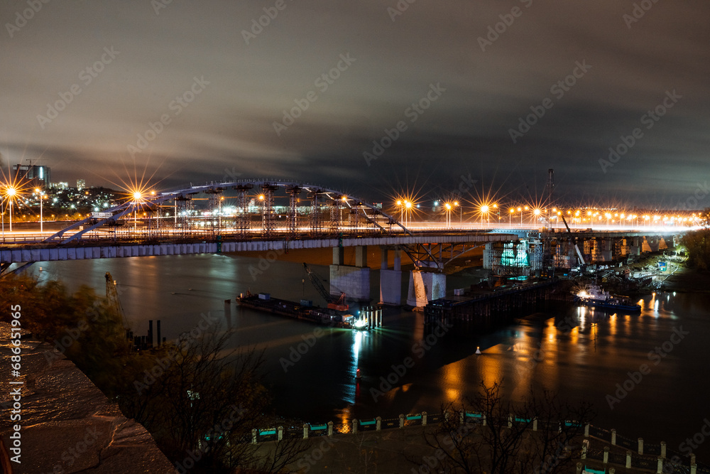 night city, photo of bridge over river, light of lanterns in the night, road bridge