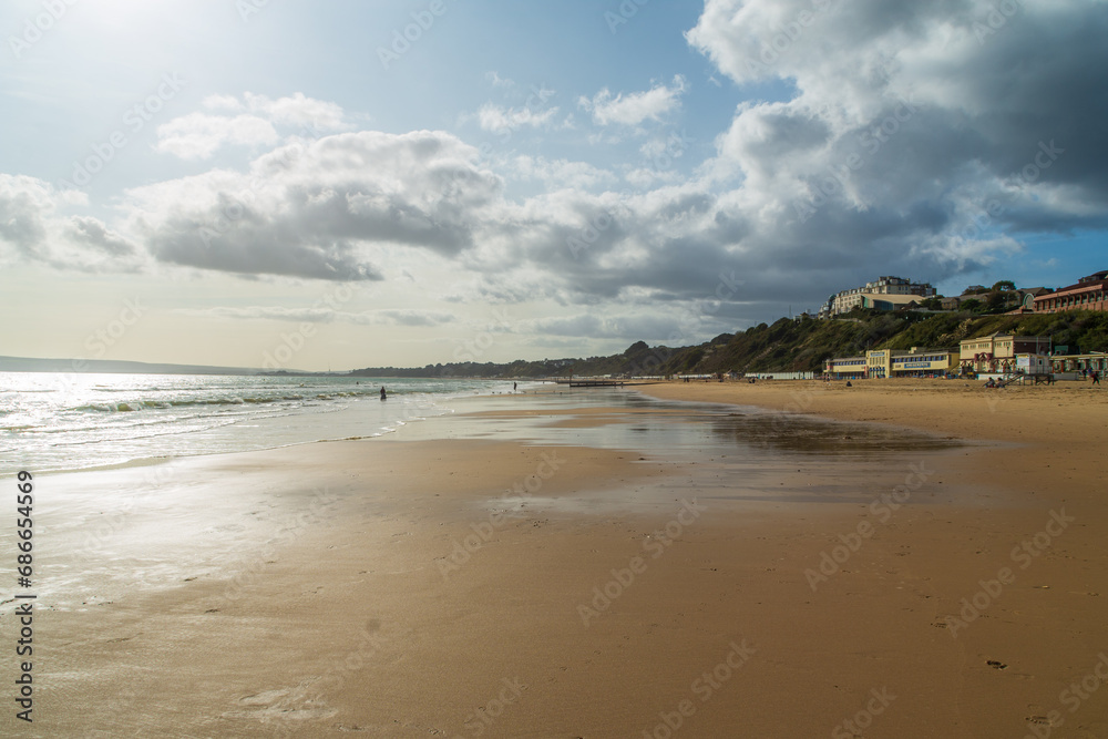 The wet sand on Bournemouth West Beach in front of West Cliff, , Bournemouth, UK