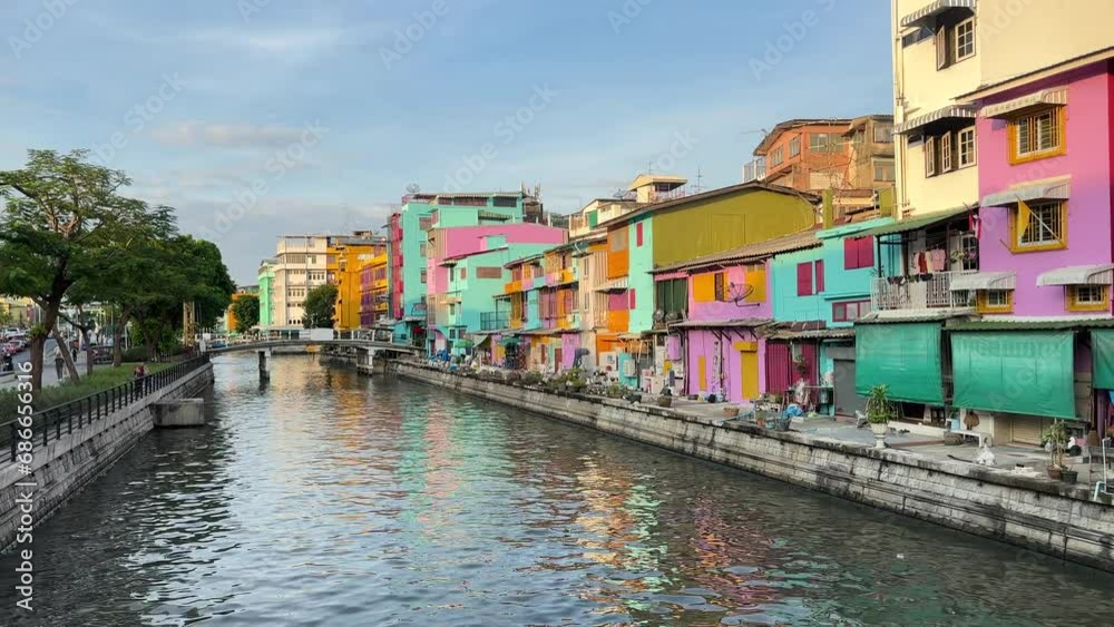 4K Evening at the Phadung Krung Kasem Canal, passenger boat In Bangkok, old buildings are renovated and newly painted, check-in for tourists. 4K Evening at the Phadung Krung Kasem Canal, passenger boat In Bangkok, old buildings are renovated and newly painted, check-in for tourists.