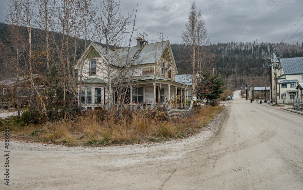 Abandoned historic wooden house on a street in Dawson City, Yukon, Canada