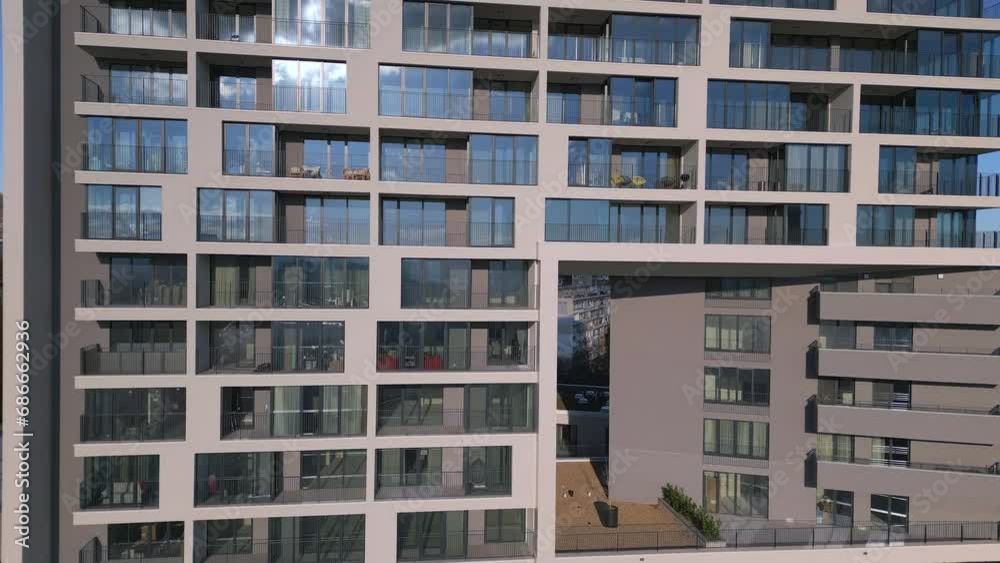 Drone flight along the facade of a modern office or residential building background Drone flight along the facade of a modern office or residential building background