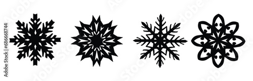 Snowflakes.Black isolated four silhouette icons on white background.
