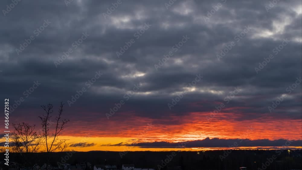Timelapse of a sunrise with red clouds