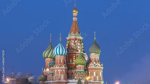Timelapse capturing the transition from winter day to night at Red Square in Moscow, Russia, with the illuminated Cathedral of St. Basil. photo