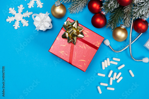 Medical Christmas. Gift In A Box For A Doctor, Nurse Or Healthcare Worker For Winter Holidays. photo